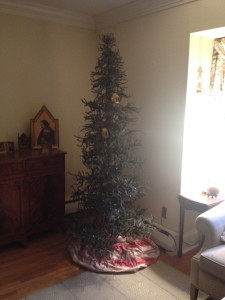 Here is my charlie brown Christmas tree, but it's deceiving! The bare branches are perfect for hanging ornaments from. Whether a fake or real tree - always look for a tree that has lots of space in between branches and isn't very full.