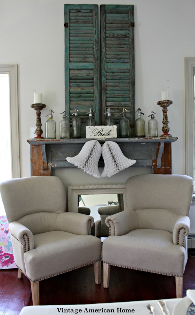 Bridal seat for a princess,farmhouse style bridal shower with antique shutters, mantle, seltzer bottles, linen chairs.