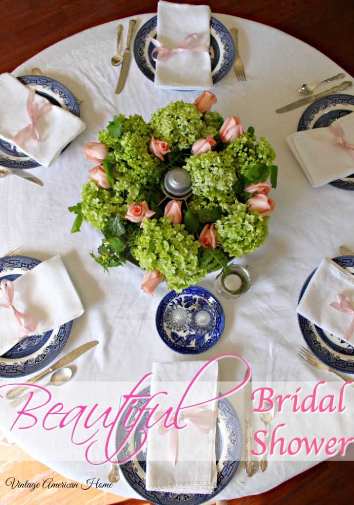 Round bridal shower table with pink ribbons, roses, centerpiece in round aluminum cubby, willow ware, silver plate